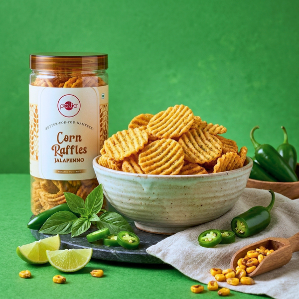 Polka Corn Raffles Jalapeno jar with crunchy corn chips in a bowl, jalapenos, and lime