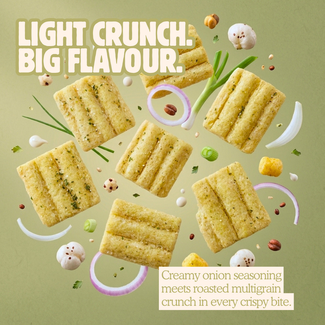 Polka cream and onion makhana crisps flying with fresh onion rings, spring onion, and spices.